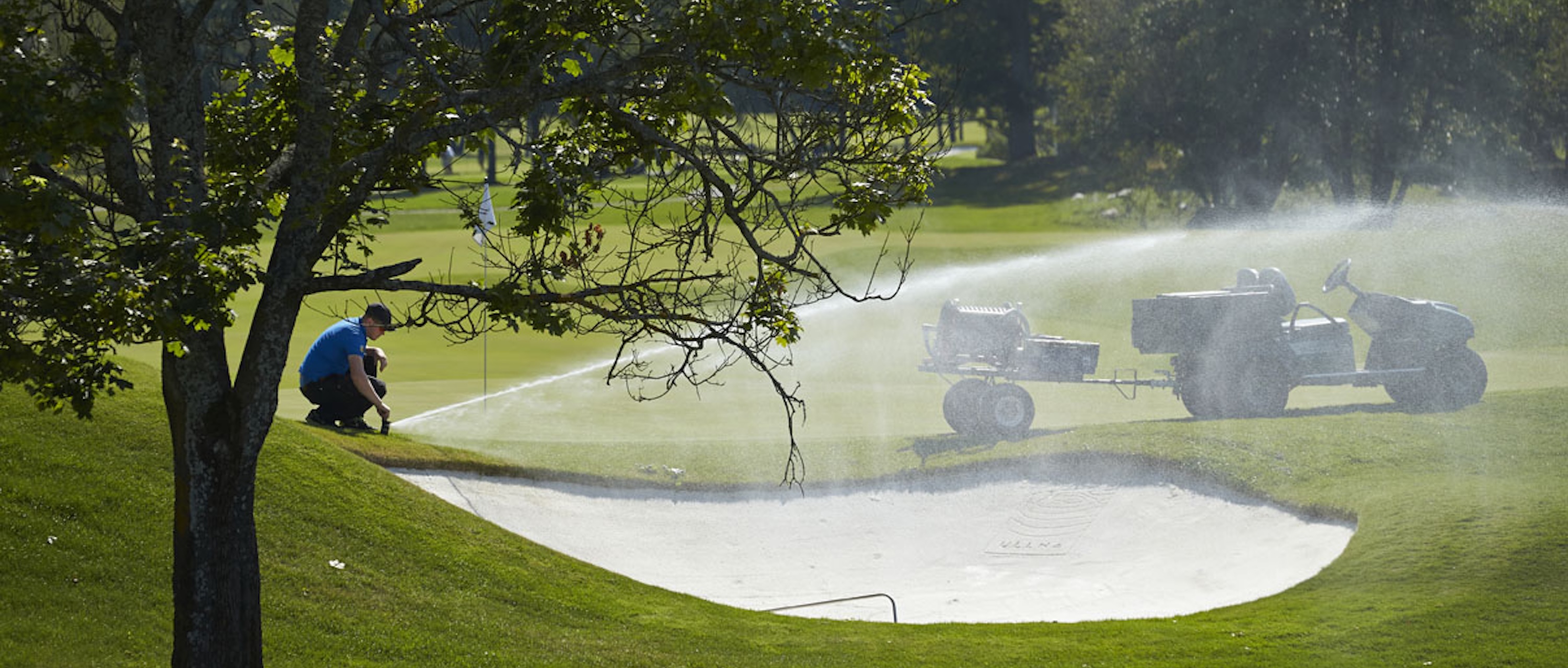 Greenkeeper user sprinkler to irrigate golf course