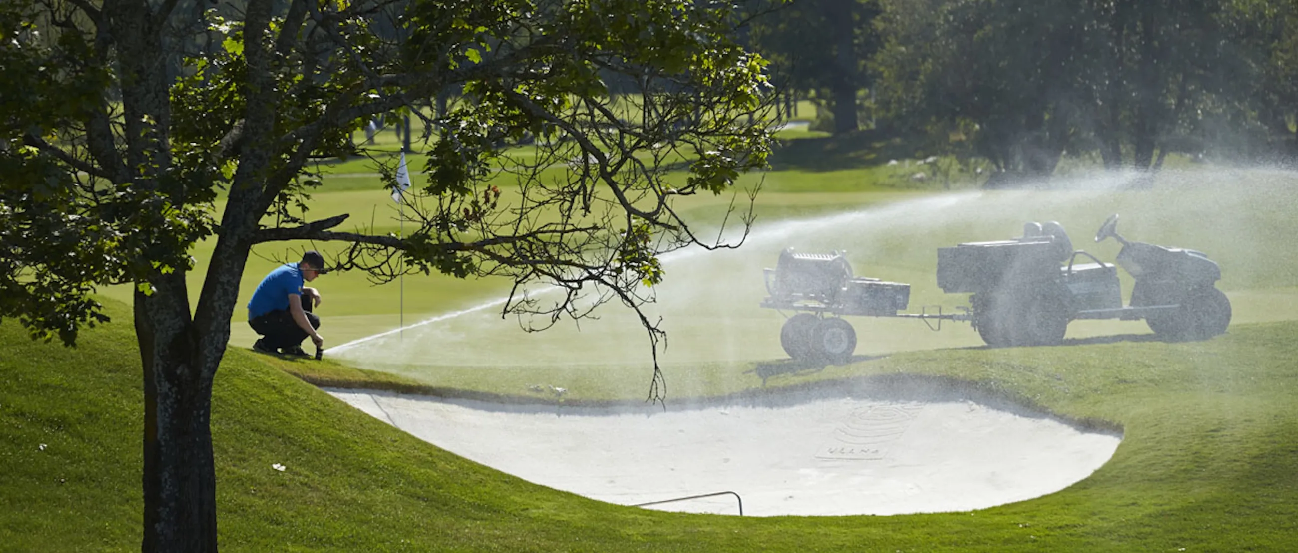 Greenkeeper user sprinkler to irrigate golf course